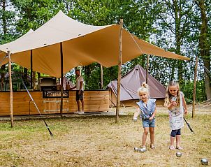 Glamping tent for 4 people in Maasbree, North Limburg. Enjoy a luxury glamping experience with children playing on the terrace in nature.