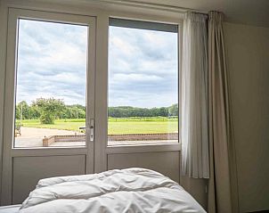 Praktische wasruimte met wasmachine in L312 vakantiehuis in Beesel, Noord Limburg.