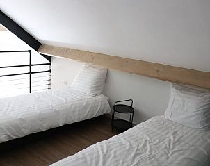 Zolderruimte in Vakantiehuis in Baexem, Noord Limburg met comfortabele bedden.