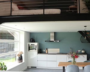 Modern kitchen and sleeping area in Holiday home in Baexem -Leudal, North Limburg, ideal for a comfortable stay in nature.