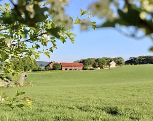 Rustic view of Holiday home in Gulpen, South Limburg, surrounded by green fields and serene nature.