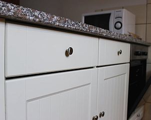 Modern kitchen in Holiday Home in Gulpen, South Limburg with stylish cabinets and appliances for a comfortable stay.