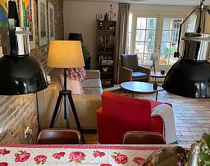 Lichte woonkamer in Vakantiehuis in Beutenaken, Zuid Limburg, met gezellige inrichting.