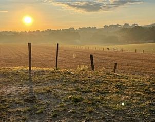 Adembenemend uitzicht bij zonsopgang in Beutenaken, Zuid Limburg, vanuit het vakantiehuis.
