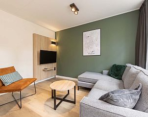 Moderne woonkamer in vrijstaande woning in Vlierden, vakantiehuis De Peel, Noord Brabant met comfortabel interieur.