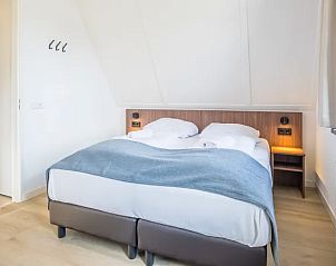 Tweede slaapkamer met dubbele bedden in 8-persoonsbungalow | 8L, Someren, De Peel.