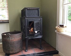 Gezellige houtkachel in Huisje in Milheeze, vakantiehuis in De Peel, Noord Brabant.