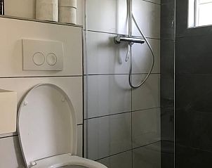 Relaxen in de hangmat bij Huisje in Milheeze, vakantiehuis in De Peel, Noord Brabant.