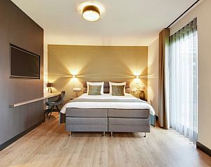 Moderne slaapkamer in Huisje in Milheeze met comfortabel tweepersoonsbed in De Peel, Noord Brabant.