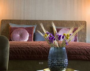 Gezellige slaapkamer in Vakantiehuisje in De Rips, De Peel, Noord Brabant met stijlvolle decoratie.