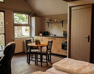 Cozy kitchen and dining area in Holiday Home in Bergeijk, ideal for a relaxing stay.