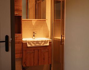 Refreshing shower and sink in Holiday home in Bergeijk, ideal for relaxation.