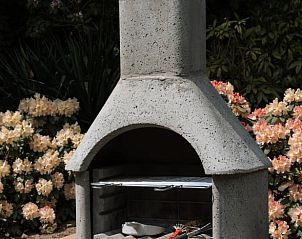 Grill im Garten von Cottage in Luyksgestel, Ferienhaus in den Kempen, Nordbrabant.