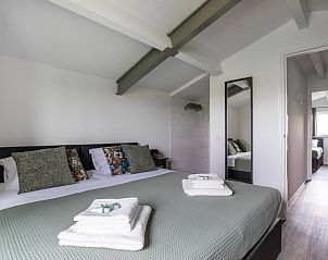 Sfeervolle slaapkamer in Vakantiehuisje in Hapert, met modern interieur, Kempen, Noord Brabant.