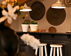 Stylish indoor area of Huisje in Moergestel, vacation home in Moergestel, North Brabant with cozy bar.