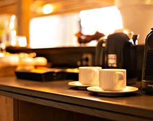 Enjoy a cup of coffee in the kitchen of Huisje in Moergestel, vacation home in Hart van Brabant, North Brabant.