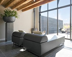 Comfortable lounge chairs in the living room of Huisje in Moergestel, vacation home in Moergestel, North Brabant.