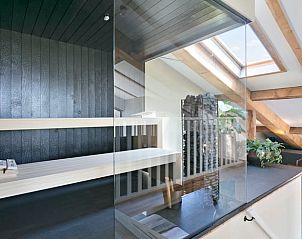 Sunny terrace in Holiday home in Moergestel, North Brabant, overlooking the green surroundings.