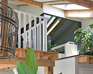 Wooden details and greenery in Holiday Home in Moergestel, North Brabant, create a warm atmosphere.