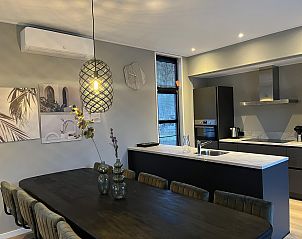 Modern kitchen and dining area in the Detached house in Kaatsheuvel, vacation home in Hart van Brabant, North Brabant.