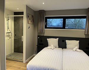 Modern bedroom in Detached house in Kaatsheuvel, Heart of Brabant, with double bed and views of nature.