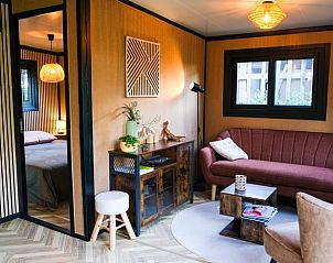 Gezellige woonkamer van Vakantiehuisje in Berlicum, Hart van Brabant. Geniet van comfort en stijl in deze vakantiewoning in Noord Brabant.