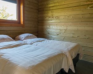 Slaapkamer met twee eenpersoonsbedden in Vakantiehuis in Drunen.