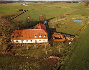 Luchtfoto van Vakantiehuisje in Boxtel, omringd door uitgestrekte velden en rustieke natuur in Hart van Brabant, Noord Brabant.