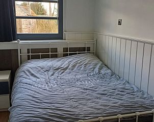 Sfeervolle slaapkamer in Vakantiehuis in Boxtel, perfect voor een ontspannen nachtrust in Noord Brabant.