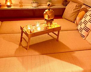 Intieme binnenruimte van Vakantiehuisje in Riel met warme verlichting, gelegen in Hart van Brabant, Noord Brabant.