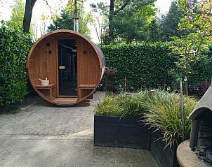 Vakantiehuis in Schaijk, Noord Brabant met een moderne sauna en groene tuin voor een ontspannen verblijf.