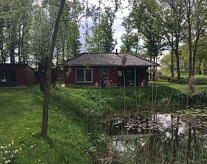 Vakantiewoning Huisje in Escharen aan een serene vijver in Noord Brabant.