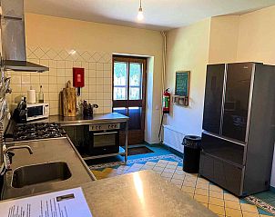 Gezellige eetruimte in BRA100 vakantiehuis, Holthees met sfeervolle verlichting.