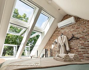 Zonnige slaapkamer in Huisje in Reek, vakantiehuis in Noord Brabant met uitzicht op de natuur.