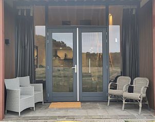 Veranda of Cottage in Rucphen, vacation home in West Brabant. Enjoy peace and nature in North Brabant with comfortable seating.