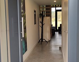 Entrance to Cottage in Rucphen, a modern vacation home in West Brabant, North Brabant, with views of nature from the hall.
