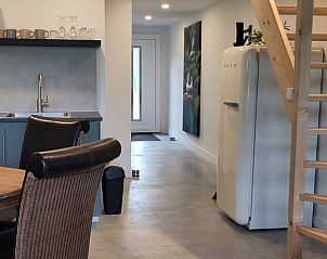 Modern kitchen in Cottage in Rucphen, vacation home in West Brabant, North Brabant, with stylish decor and spacious dining area.