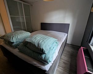 Stijlvolle slaapkamer in Vakantiehuis in Heerle, West Brabant.