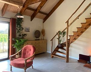 Wooden staircase and cozy decor in Holiday home in Callantsoog, North Sea coast, North Holland.