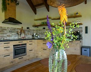 Detail of kitchen with flowers in Holiday home in Callantsoog, North Sea coast, North Holland.
