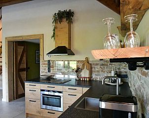 Kitchen with wooden elements in Holiday home in Callantsoog, North Sea coast, North Holland.