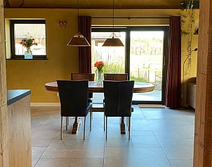 Dining area with view in Holiday home in Callantsoog, North Sea coast, North Holland.