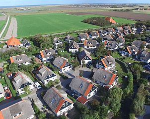 Aerial view of Buitenplaats 100 Callantsoog, a vacation home on the North Sea coast in North Holland, surrounded by nature.
