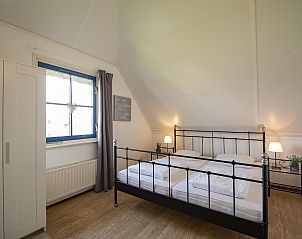 Attractive bedroom in Buitenplaats 100 Callantsoog vacation home on the North Sea coast in North Holland.