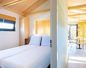 Modern bathroom of Typical Dutch 4 vacation home in Callantsoog, North Sea coast, with stylish shower and humorous tile.