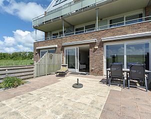 Sunny terrace at Duinerei C002 Groote Keeten vacation home in Callantsoog, North Sea coast, North Holland.