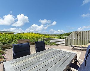 Cozy terrace with view at Duinerei C002 Groote Keeten vacation home in Callantsoog, North Sea coast, North Holland.