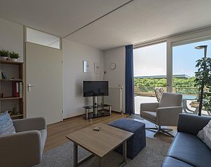 Cozy living room in Duinerei C002 Groote Keeten vacation home in Callantsoog, North Sea coast, North Holland.