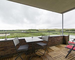 Cozy terrace of Duinerei C103 Groote Keeten overlooking the dunes in Callantsoog, North Holland.