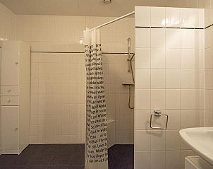 Stylish bathroom in Duinerei C103 Groote Keeten vacation home in Callantsoog, North Holland.